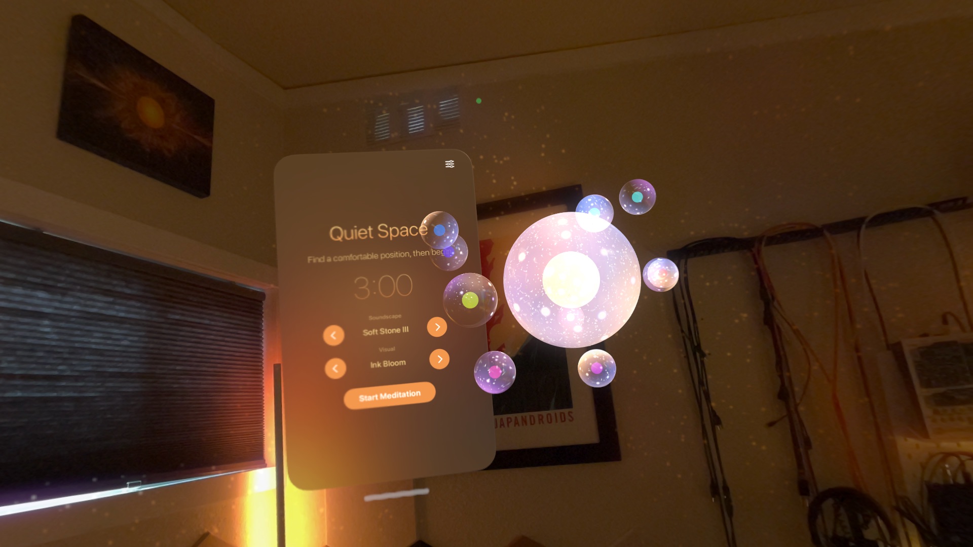 A glowing orb with small bubbles orbiting it, floating in a real living room seen through Apple Vision Pro, beside the Quiet Space controls.