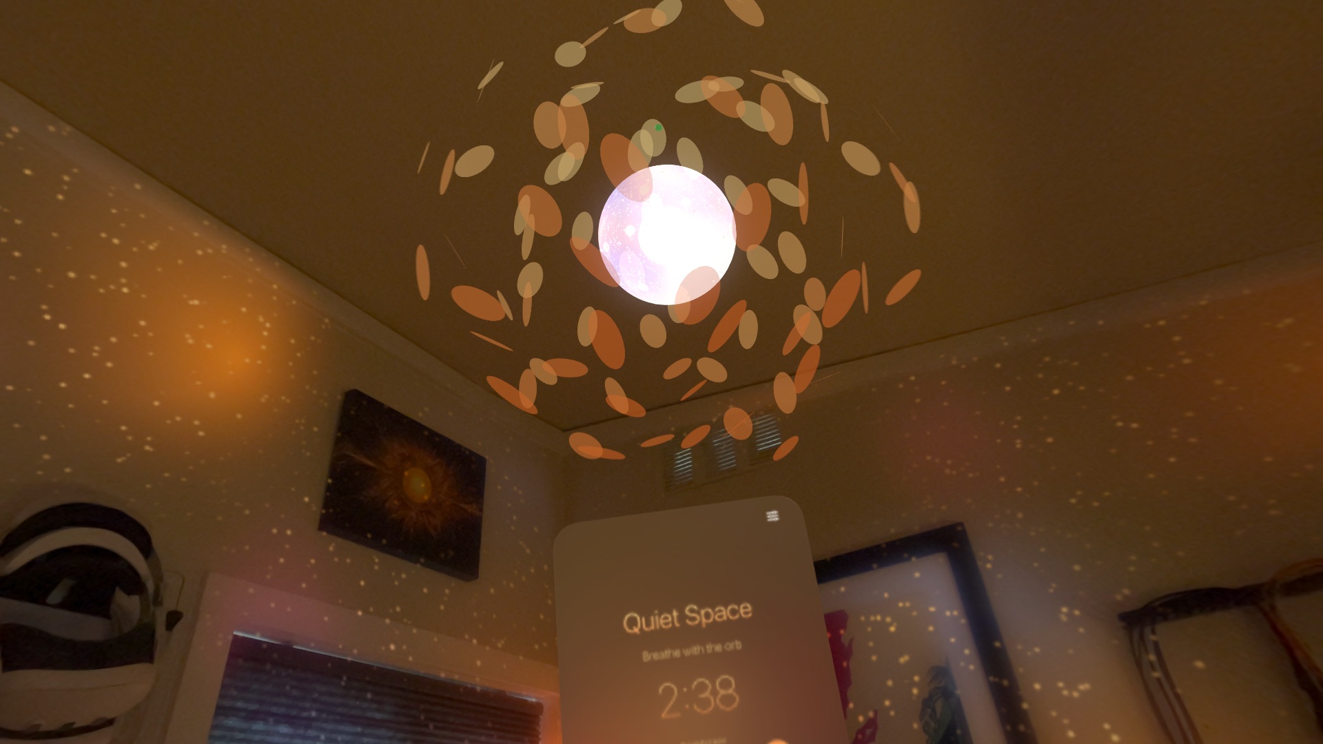 Orange petals swirl around a glowing orb on the ceiling, above a panel reading Breathe with the orb.